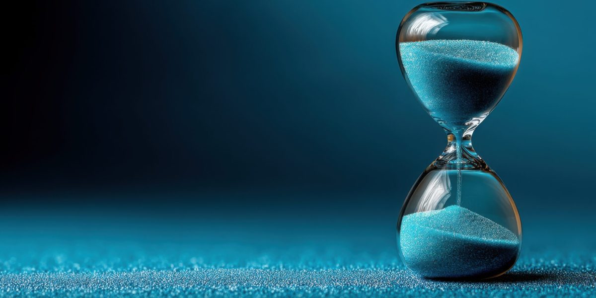 Hourglass representing the concept of weighted delay in wealth and the heavy yet patient wait for financial success
